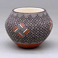 A small polychrome jar decorated with a four panel fineline and geometric design
 by Rebecca Lucario of Acoma