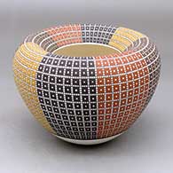 A polychrome jar with an Infinity rim and decorated with an eight-panel geometric design built of tiny colored squares
 by Frederica Antonio of Acoma
