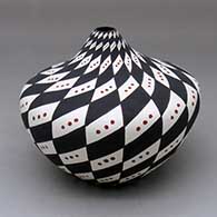 A polychrome tear drop jar decorated with a spiral checkerboard with snow flurries geometric design
 by Sandra Victorino of Acoma