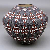 A polychrome jar decorated with a stylized checkerboard and fineline geometric design
 by Sandra Victorino of Acoma