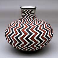 A polychrome jar with a short neck decorated from top to bottom with a lightning bolt geometric design
 by Paula Estevan of Acoma
