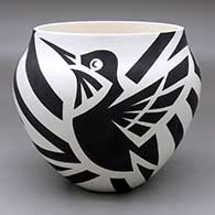 A black on white jar decorated with a hummingbird and geometric design
 by Eric Lewis of Acoma