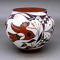A polychrome jar decorated with a four panel parrot, branch and geometric design
 by Franklin Peters of Acoma