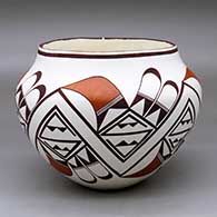 A polychrome jar decorated with a bird element and geometric design around the body
 by Franklin Peters of Acoma