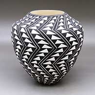 A black on white jar decorated with a geometric design
 by Sandra Victorino of Acoma