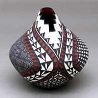 A polychrome jar with a kiva step cut opening and decorated with a fineline, checkerboard, yucca leaf snowflake and geometric design
 by Sandra Victorino of Acoma