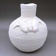 A large corrugated white jar with an organic opening and three ear-of-corn appliques on the shoulder
 by Jackie Shutiva of Acoma