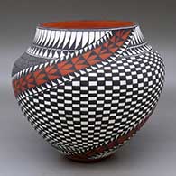 A polychrome jar decorated with a fineline, checkerboard, feather, kiva step and spiraling geometric design
 by Sandra Victorino of Acoma