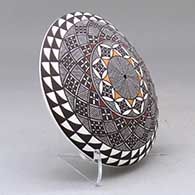 A polychrome seed pot decorated on top with a fineline and geometric design, click or tap to see a larger version