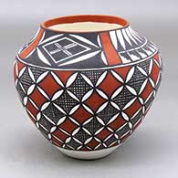 A polychrome jar decorated with a fineline, pumpkin seed snowflake, kiva step and geometric design
 by Sandra Victorino of Acoma