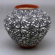 A polychrome jar decorated around the body with a black on white geometric design
 by Sandra Victorino of Acoma