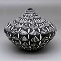 A black on white tear drop jar decorated with a geometric design
 by Sandra Victorino of Acoma