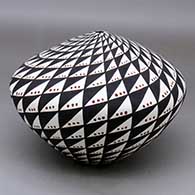 A polychrome seed pot decorated with a spiral mesa and snowflake design
 by Sandra Victorino of Acoma