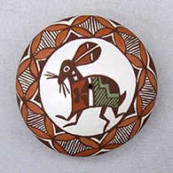 A polychrome seed pot decorated with an ancient Mimbres rabbit, fineline and geometric design
 by Diane Lewis of Acoma