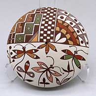 Click for a larger view A polychrome seed pot decorated with a dragonfly, flower, checkerboard and geometric design
by Diane Lewis of Acoma