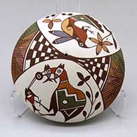 A polychrome seed pot decorated with a cloudeater, fish, hummingbird, flower, checkerboard, fineline and geometric design
 by Diane Lewis of Acoma