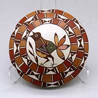 A polychrome seed pot decorated with a bird, branch and geometric design
 by Diane Lewis of Acoma