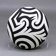 A black on white seed pot decorated with a three panel spiral and geometric design
 by Eric Lewis of Acoma