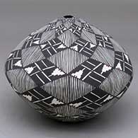 A polychrome seed pot decorated with a fineline, kiva step and geometric design
 by Sandra Victorino of Acoma