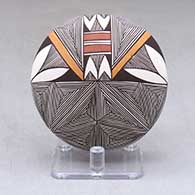 A polychrome seed pot decorated above the shoulder with a snowflake fineline and geometric design
 by Shaylene Chino of Acoma