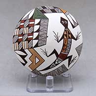 A polychrome seed pot decorated above the shoulder with a lizard, fineline and geometric design
 by George Concho Jr of Acoma