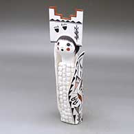 A polychrome Corn Maiden figure wearing a tablito and decorated with a butterfly, lizard, lady bug, kokopelli and fineline geometric design
 by Judy Lewis of Acoma