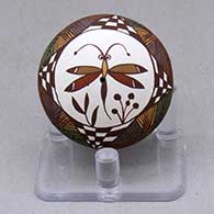 A miniature polychrome seed pot decorated with a dragonfly, plant, fineline and geometric design
 by Diane Lewis of Acoma