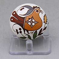 A miniature polychrome seed pot decorated with a parrot, branch, flower and geometric design
 by Diane Lewis of Acoma