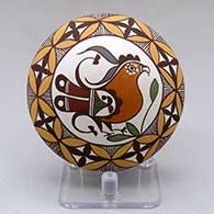 A polychrome seed pot decorated above the shoulder with a parrot, branch and geometric design
 by Diane Lewis of Acoma