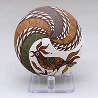 A polychrome seed pot decorated above the shoulder with a parrot, branch, fineline and geometric design
 by Diane Lewis of Acoma