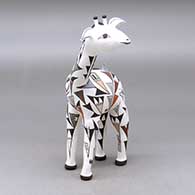 A polychrome giraffe figure with a bird, lady bug, butterfly and geometric design
 by Judy Lewis of Acoma