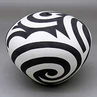 A black on white seed pot decorated with a three panel spiral and geometric design
 by Eric Lewis of Acoma