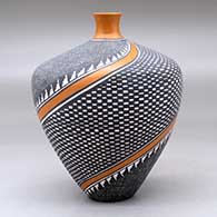 A polychrome thin neck vase decorated with a four panel spiraling checkerboard, fineline and geometric design, click or tap to see a larger version