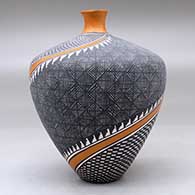A polychrome thin neck vase decorated with a four panel spiraling checkerboard, fineline and geometric design, click or tap to see a larger version