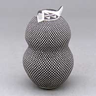 A polychrome owl figure decorated with a checkerboard tiny square and geometric design, click or tap to see a larger version