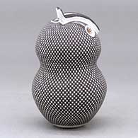 A polychrome owl figure decorated with a checkerboard tiny square and geometric design, click or tap to see a larger version