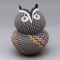 A polychrome owl figure decorated with a tiny square and geometric design
 by Frederica Antonio of Acoma