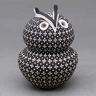 A polychrome owl figure decorated with a tiny square and geometric design
 by Frederica Antonio of Acoma