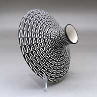 A black on white low shouldered jar decorated with a geometric design, click or tap to see a larger version