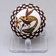 A miniature polychrome seed pot decorated with a hummingbird, flower, checkerboard and geometric design
 by Diane Lewis of Acoma