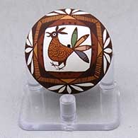 A miniature polychrome seed pot decorated with a bird, fineline and geometric design
 by Diane Lewis of Acoma