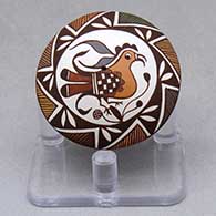 A miniature polychrome seed pot decorated with a parrot, branch, fineline and geometric design
 by Diane Lewis of Acoma