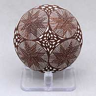 A black on white seed pot decorated above the shoulder with a medallion, fineline, stylized checkerboard and geometric design
 by Diane Lewis of Acoma