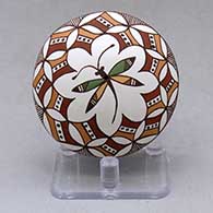A polychrome seed pot decorated above the shoulder with a dragonfly and geometric design
 by Diane Lewis of Acoma
