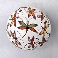 A miniature polychrome seed pot decorated above the shoulder with a dragonfly, plant and geometric design
 by Diane Lewis of Acoma
