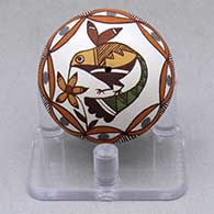 A miniature polychrome seed pot decorated with a hummingbird, flower and geometric design
 by Diane Lewis of Acoma