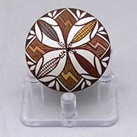 A miniature polychrome seed pot decorated with a four seasons ears of corn, fineline and geometric design
 by Diane Lewis of Acoma