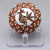 A miniature polychrome seed pot decorated with a bird and geometric design
 by Diane Lewis of Acoma
