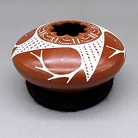 Red and white jar with a geometric cut opening and a sgraffito and painted geometric design
 by Angel Amaya of Mata Ortiz and Casas Grandes