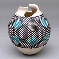 A polychrome jar with a geometric cut opening and a cuadrillos-based geometric design around the body
 by Armida Saenz of Mata Ortiz and Casas Grandes
